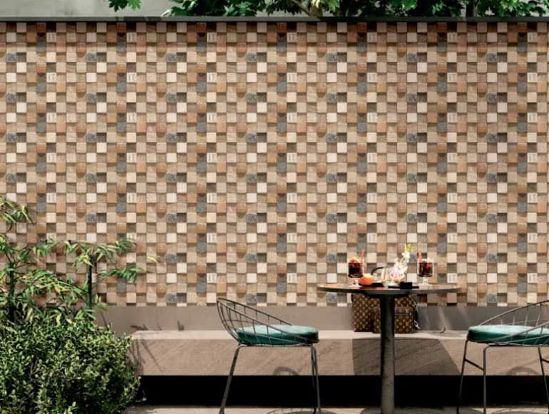 Stylish front elevation with a beige mosaic wall, contrasting black chairs, and fresh greenery.